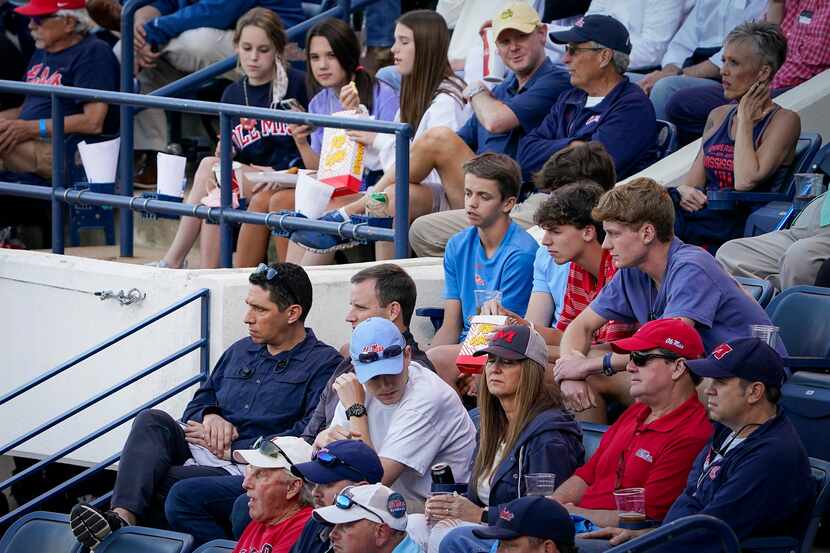 Texas Ranges president, baseball operations, Jon Daniels (bottom left) watches an NCAA...