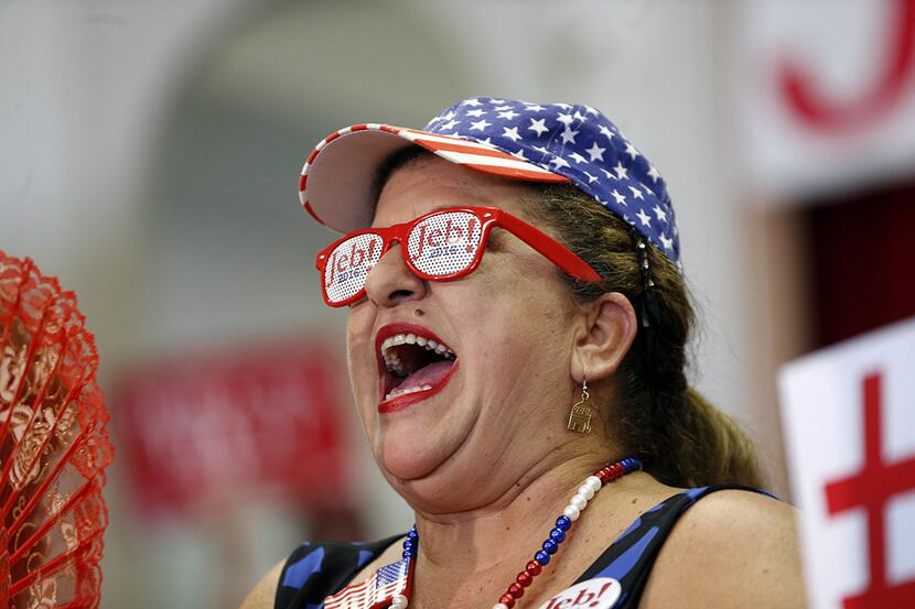 Roxanna Greene, of Hialeah, FL, yells from the crowd as Republican presidential candidate...