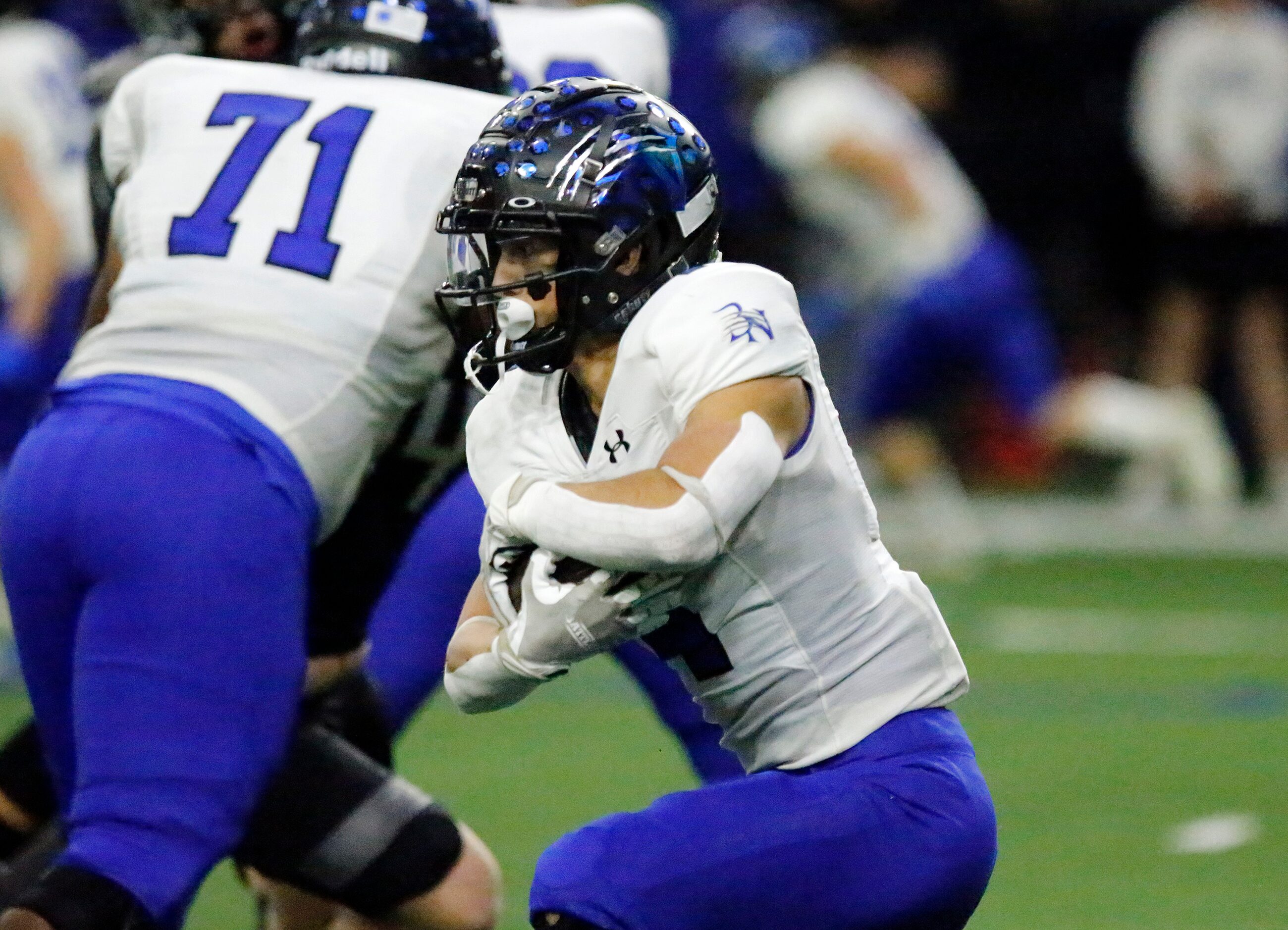 Byron Nelson High School running back Michael Giordano (4) carries the football during the...