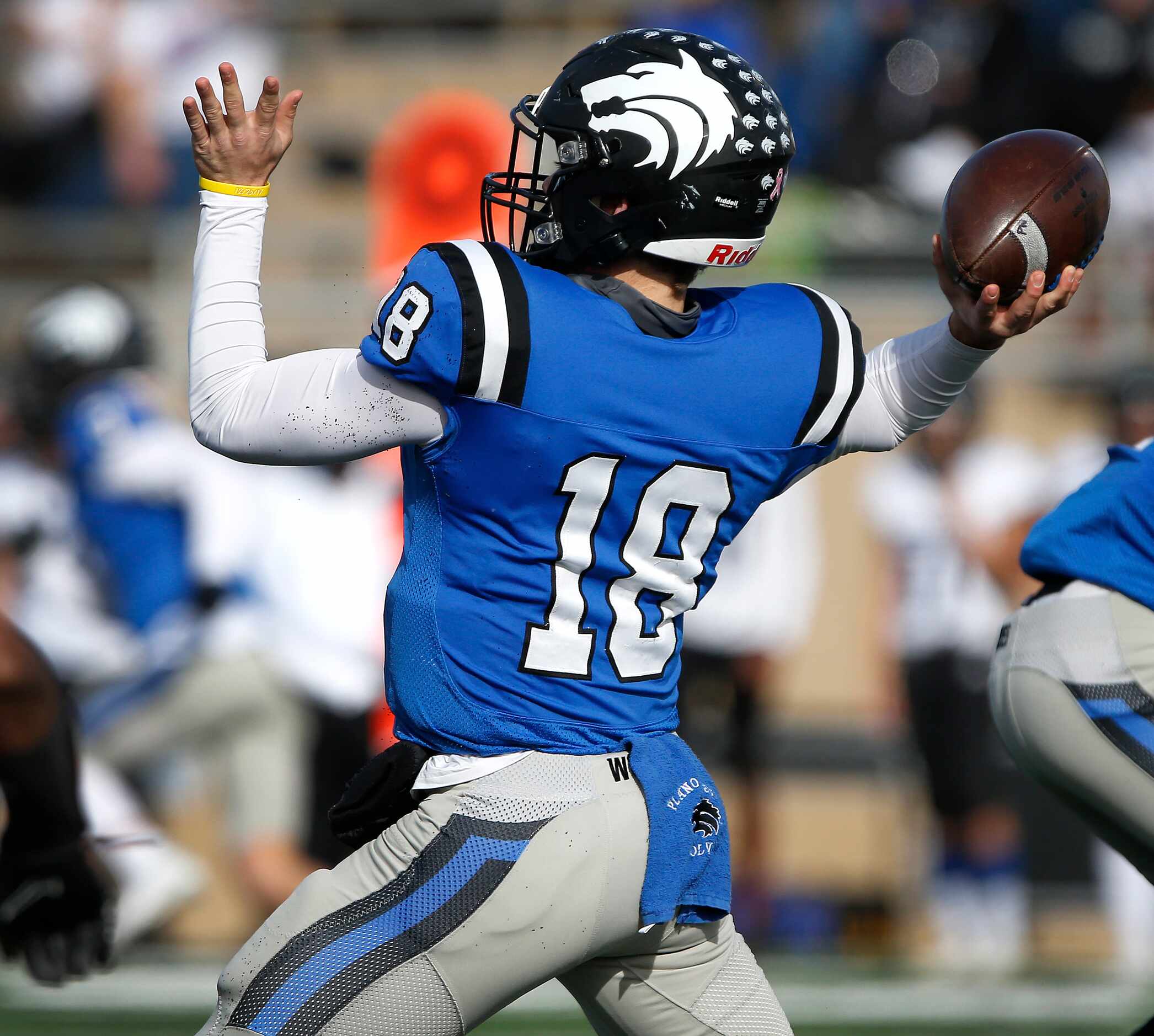 Plano West High School quarterback Greg Draughn (18) throws a pass during the first half as...