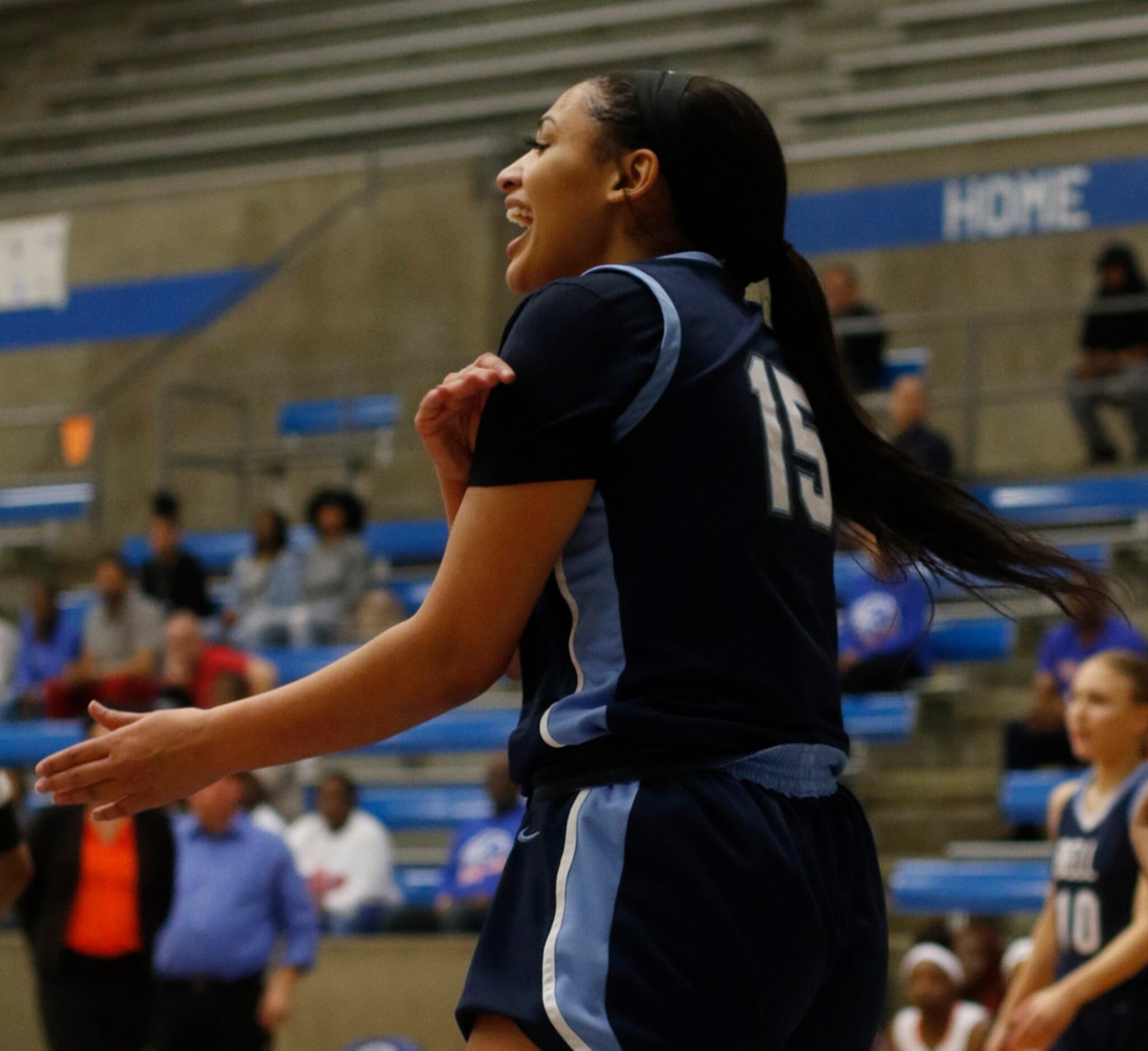 Hurst L.D. Bell guard Myra Gordon (15) reacts after scoring on a fast break during first...