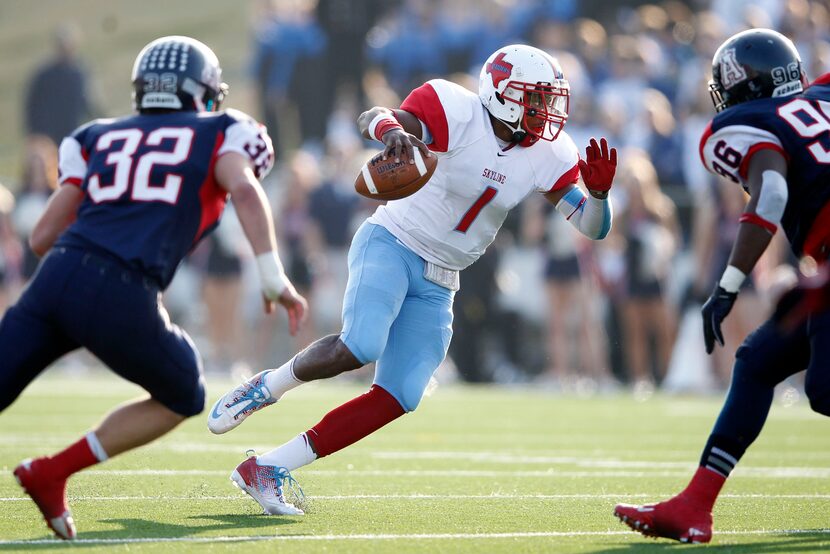 Skyline's Devante Kincade (1) runs up the field as Allen's Zack Bishop (32) and Byron Bonds...