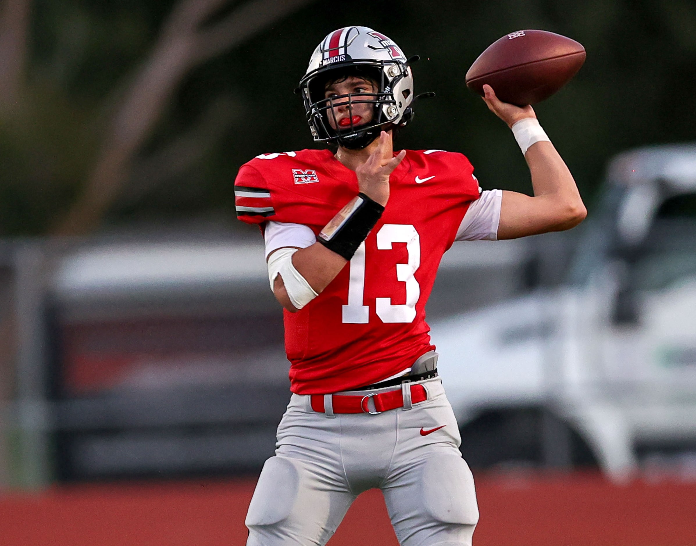 Flower Mound Marcus quarterback Colton Nussmeier (13) attempts a pass against Richardson...