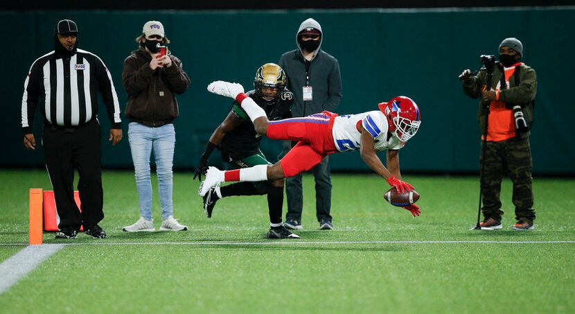 Duncanville sophomore wide receiver Lontrell Turner (22) scores a touchdown as DeSoto junior...