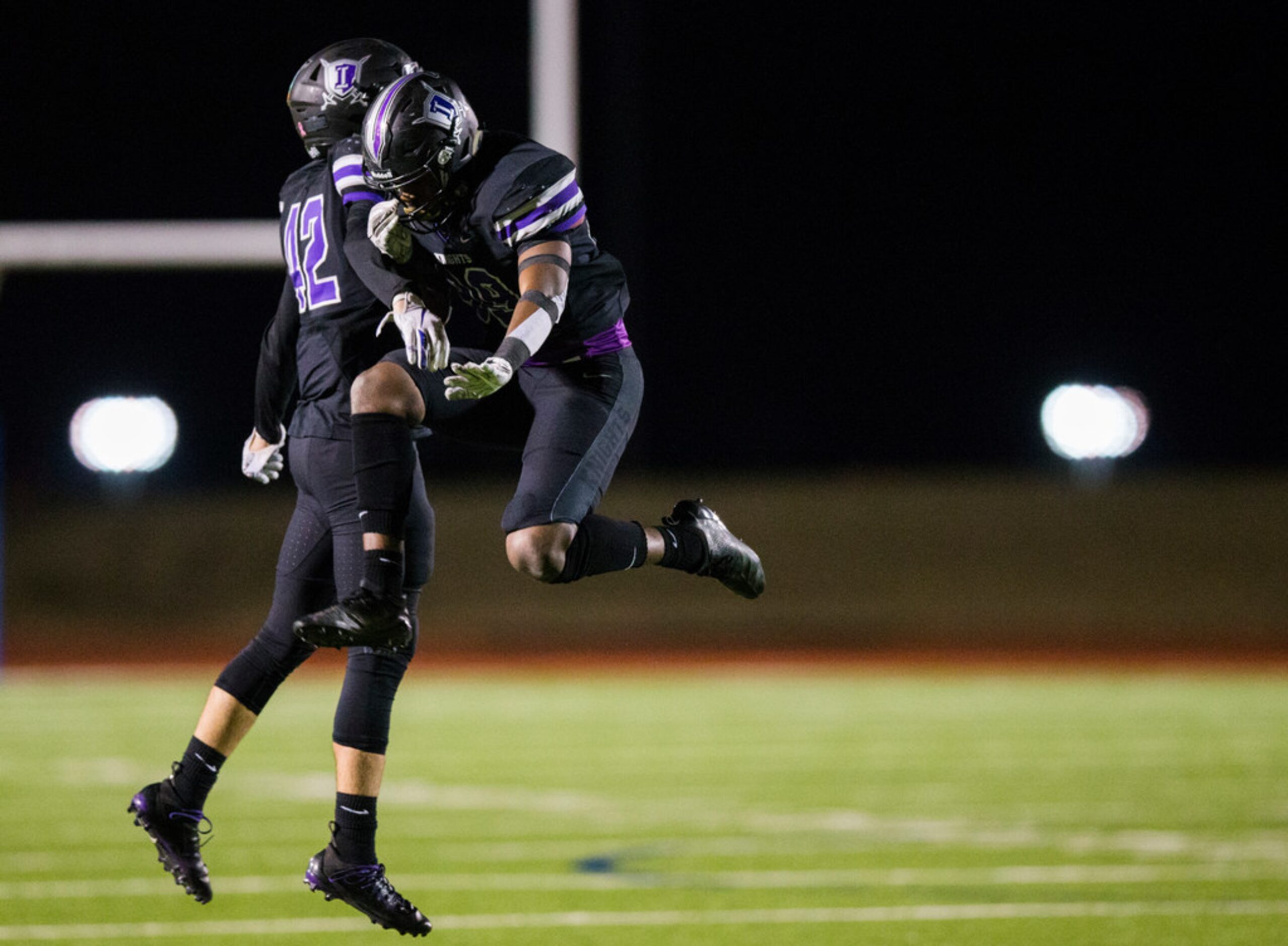 Frisco Independence linebacker Key Nash (42) and defensive lineman Josh Gilliam (99)...