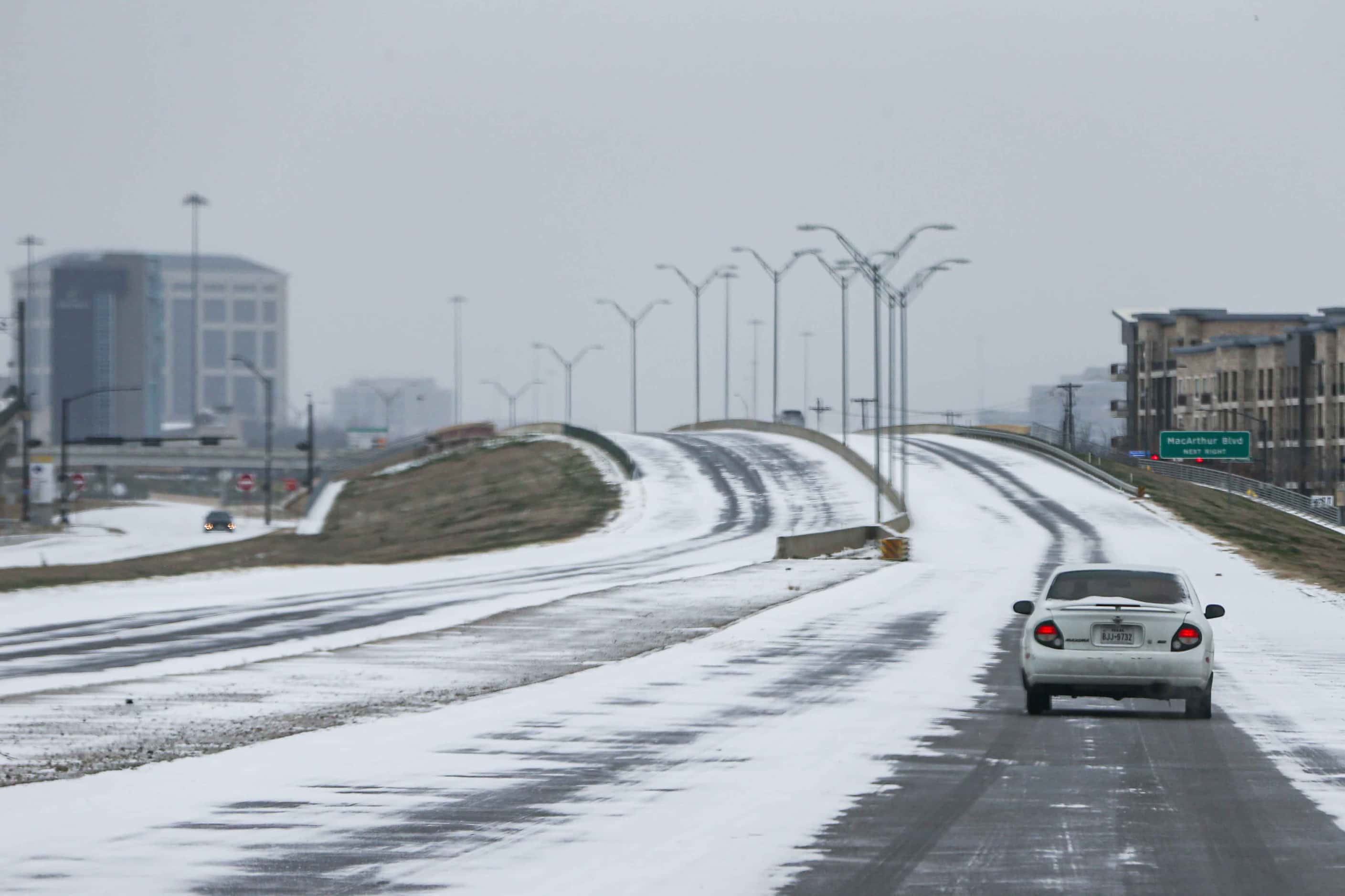 Light traffic on TX-348 Spur near MacArthur Blvd as winter flurries arrive in Irving on...