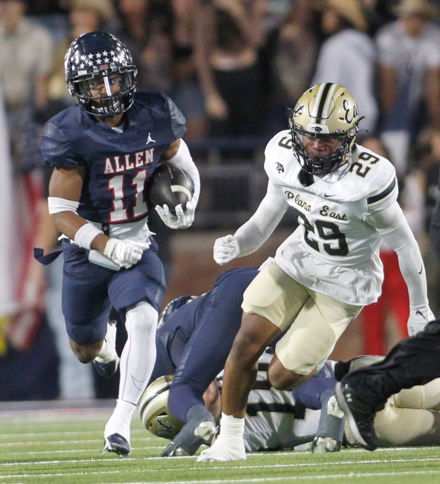 Allen running back Lyndon Spriggs (11) breaks into the Plano East secondary as Panthers...