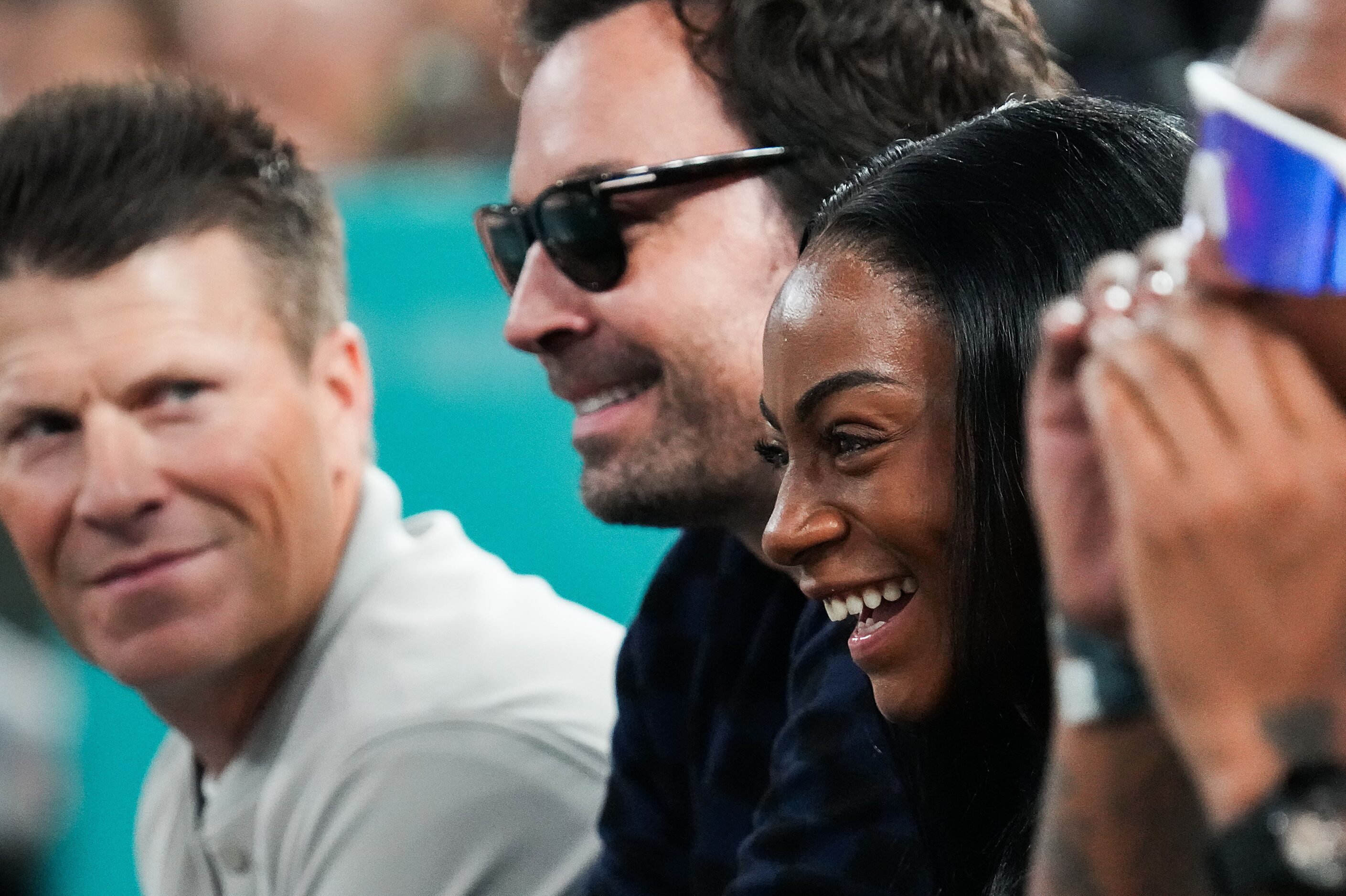 Sha’carri Richardson watches from courtside with Jimmy Fallon during the men's gold medal...