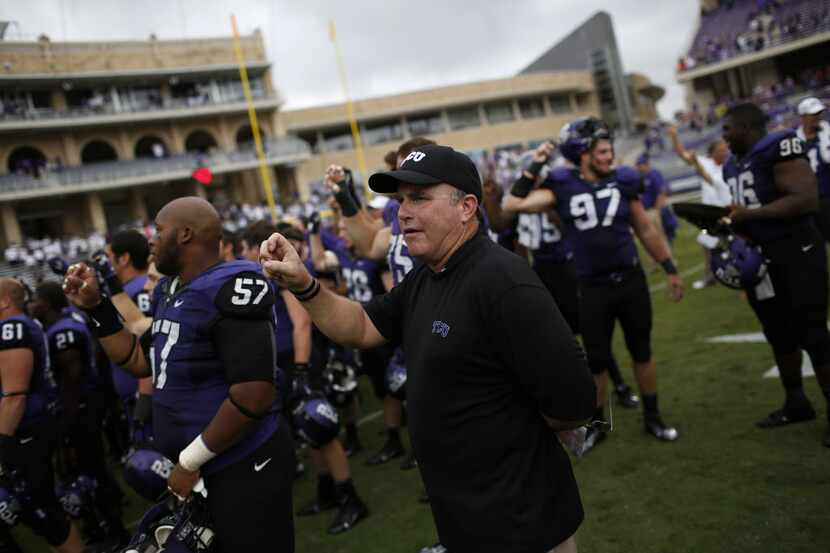 TCU head coach Gary Patterson celebrates after winning a game against Southern Methodist...