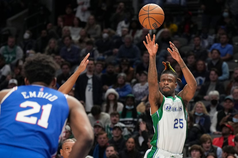 Dallas Mavericks forward Reggie Bullock (25) shoots a 3-pointer as Philadelphia 76ers center...