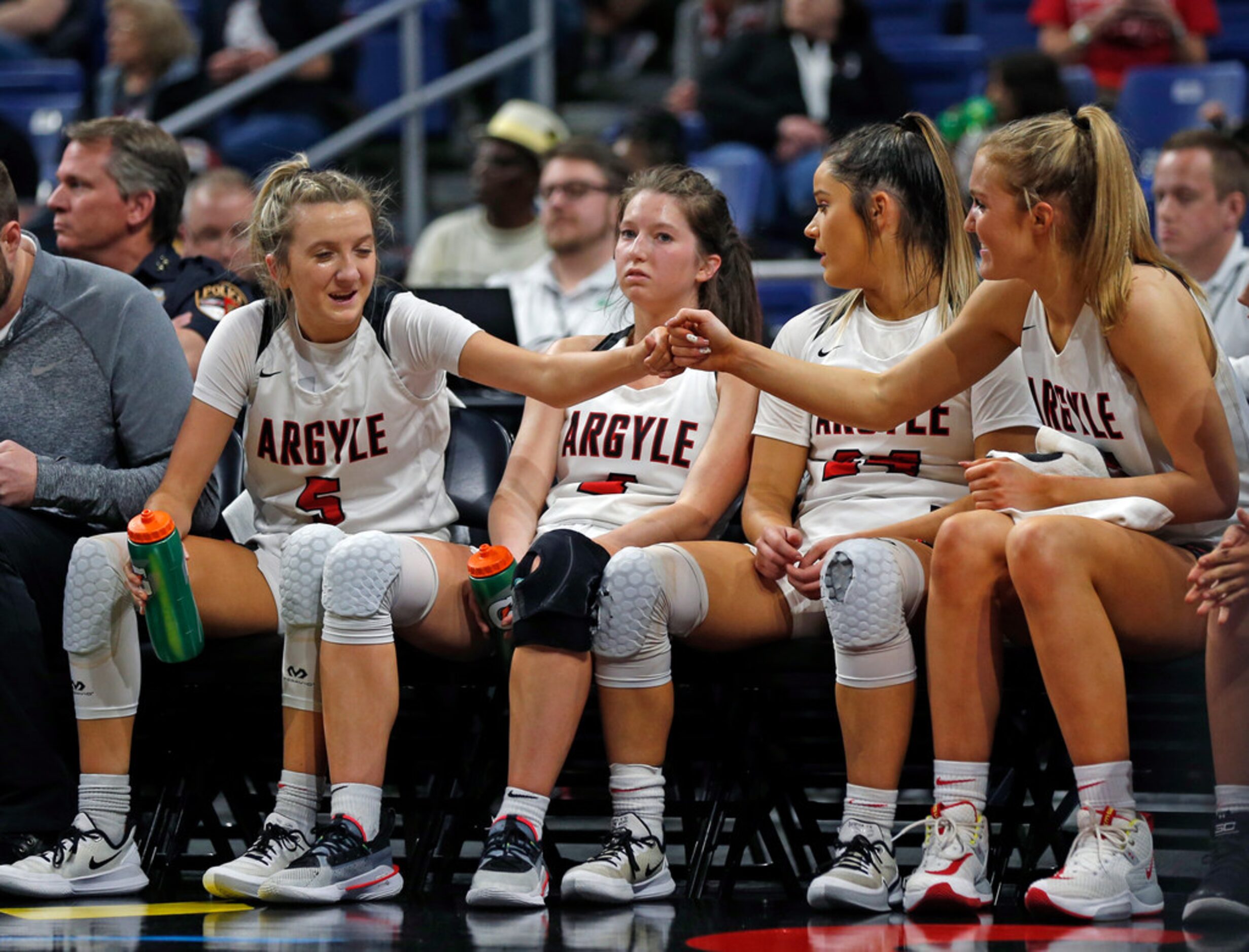 Argyle guard Bailey Timmons #4 congratulates Argyle forward Shelby Henches #35 in closing...