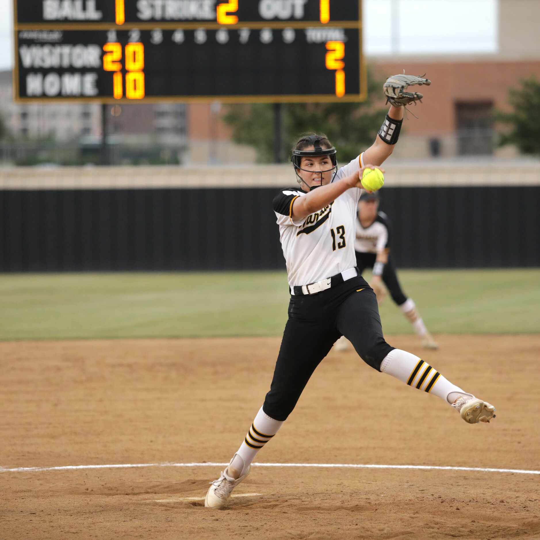 Frisco Memorial High School #13, Madelyn Muller, pitches during a softball game against The...