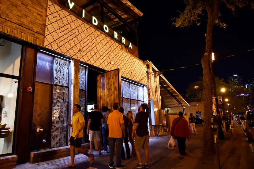 Diners wait outside for dinner at Vidorra, the new Deep Ellum restaurant in Dallas, on a...
