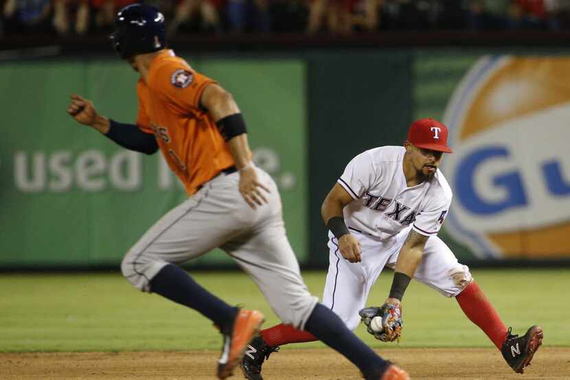 Texas Rangers second baseman Rougned Odor (12) fields the ball to throw out Houston Astros...