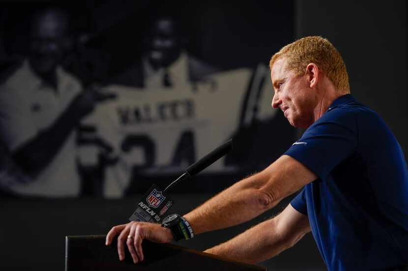 Dallas Cowboys head coach Jason Garrett addresses the media after a victory over the...