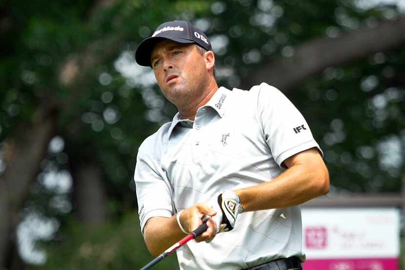 PGA golfer Ryan Palmer of Colleyville watches his drive on No. 9 at the Crowne Plaza...