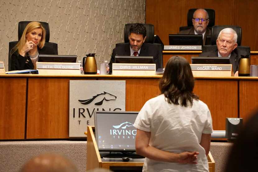 Irving Mayor Beth Van Duyne listens to residence speak out against a chicken ordinance...