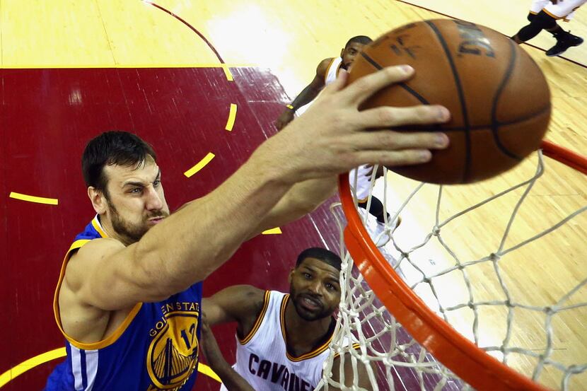 CLEVELAND, OH - JUNE 08:  Andrew Bogut #12 of the Golden State Warriors dunks the ball...
