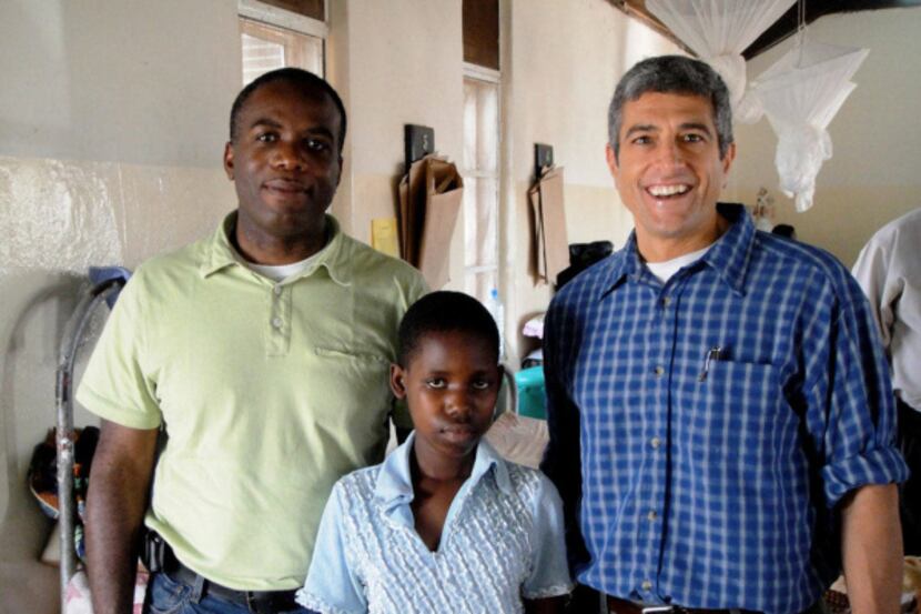 Dr. Lieberman and Dr. Selvon St. Clair stand with a patient at Mulago Hospital. After a few...