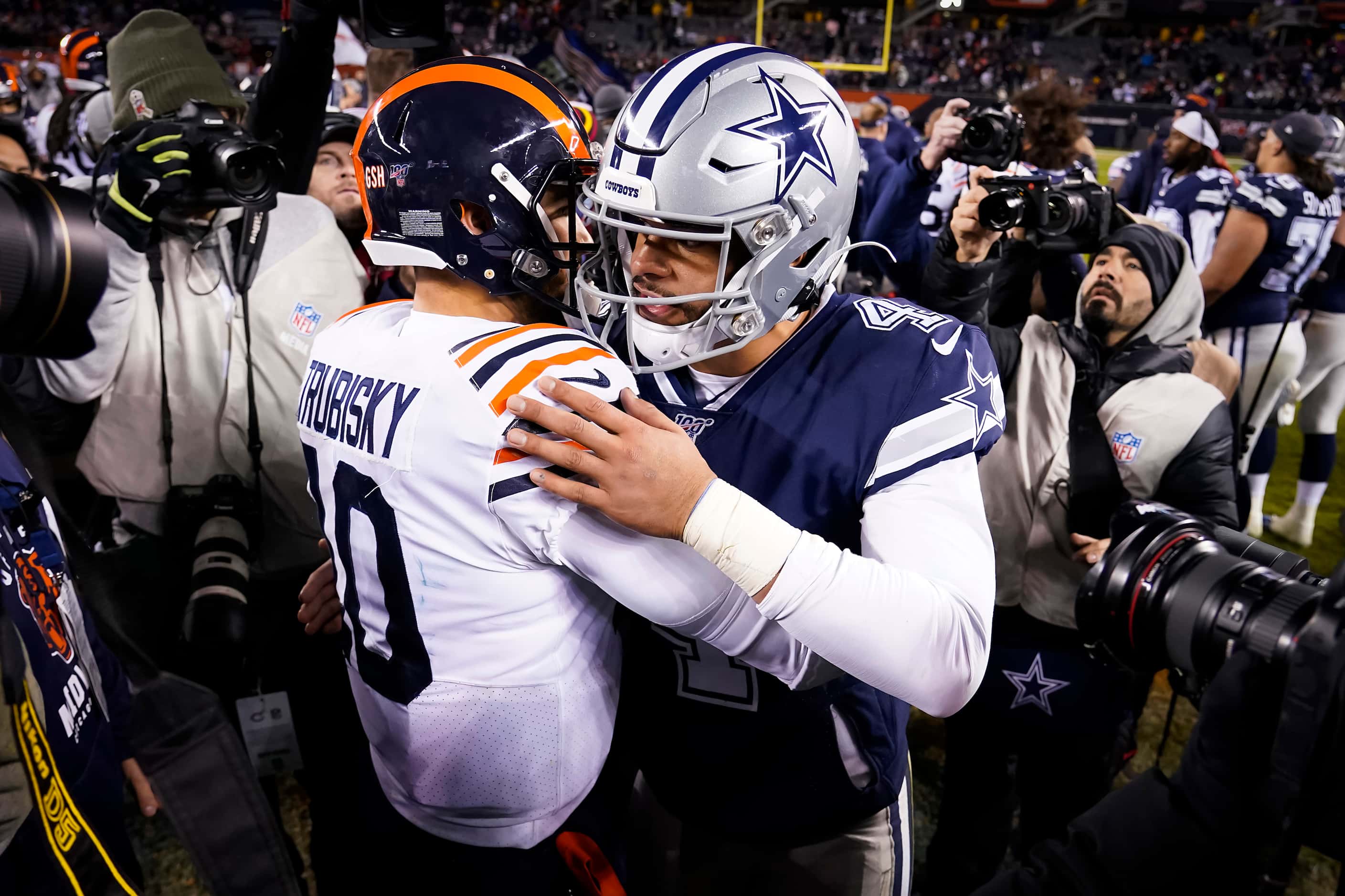 Dallas Cowboys quarterback Dak Prescott hugs Chicago Bears quarterback Mitchell Trubisky...