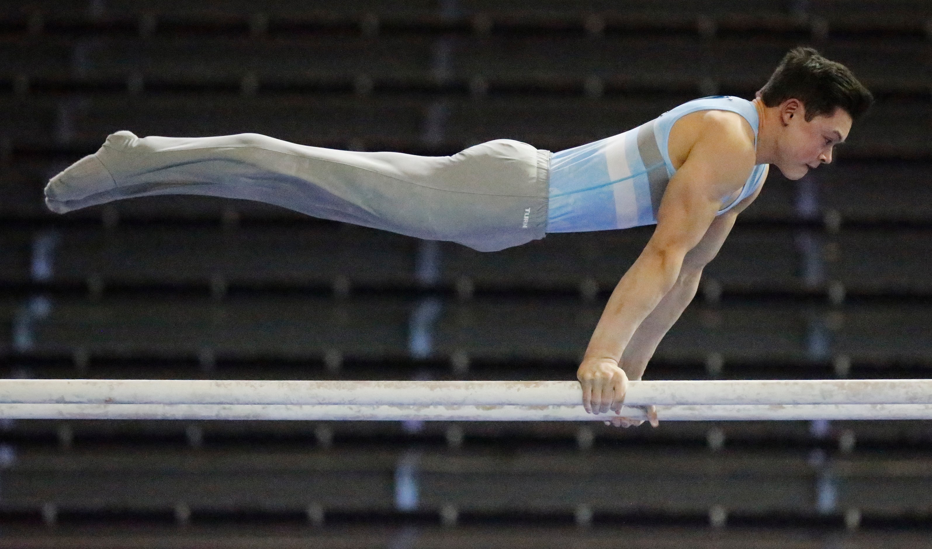 David Shamah with WOGA Gymnastics won the parallel bars in the junior division during the...