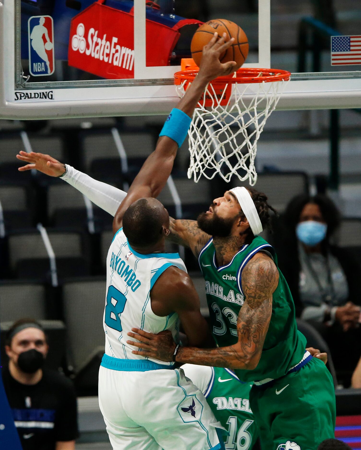 Charlotte Hornets center Bismack Biyombo (8) dunks the ball on Dallas Mavericks center...