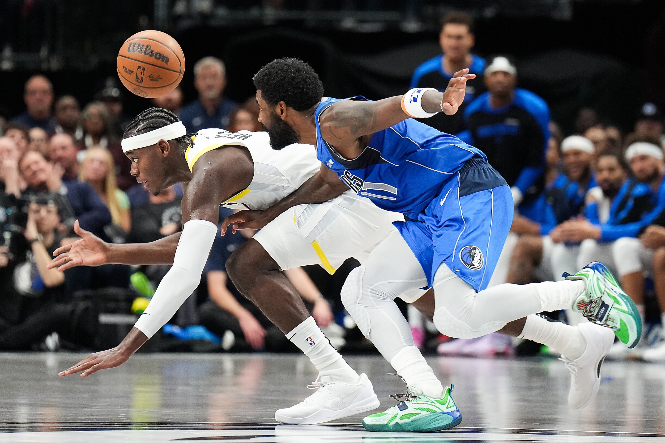 Dallas Mavericks guard Kyrie Irving (11) chases a loose ball against Utah Jazz forward...