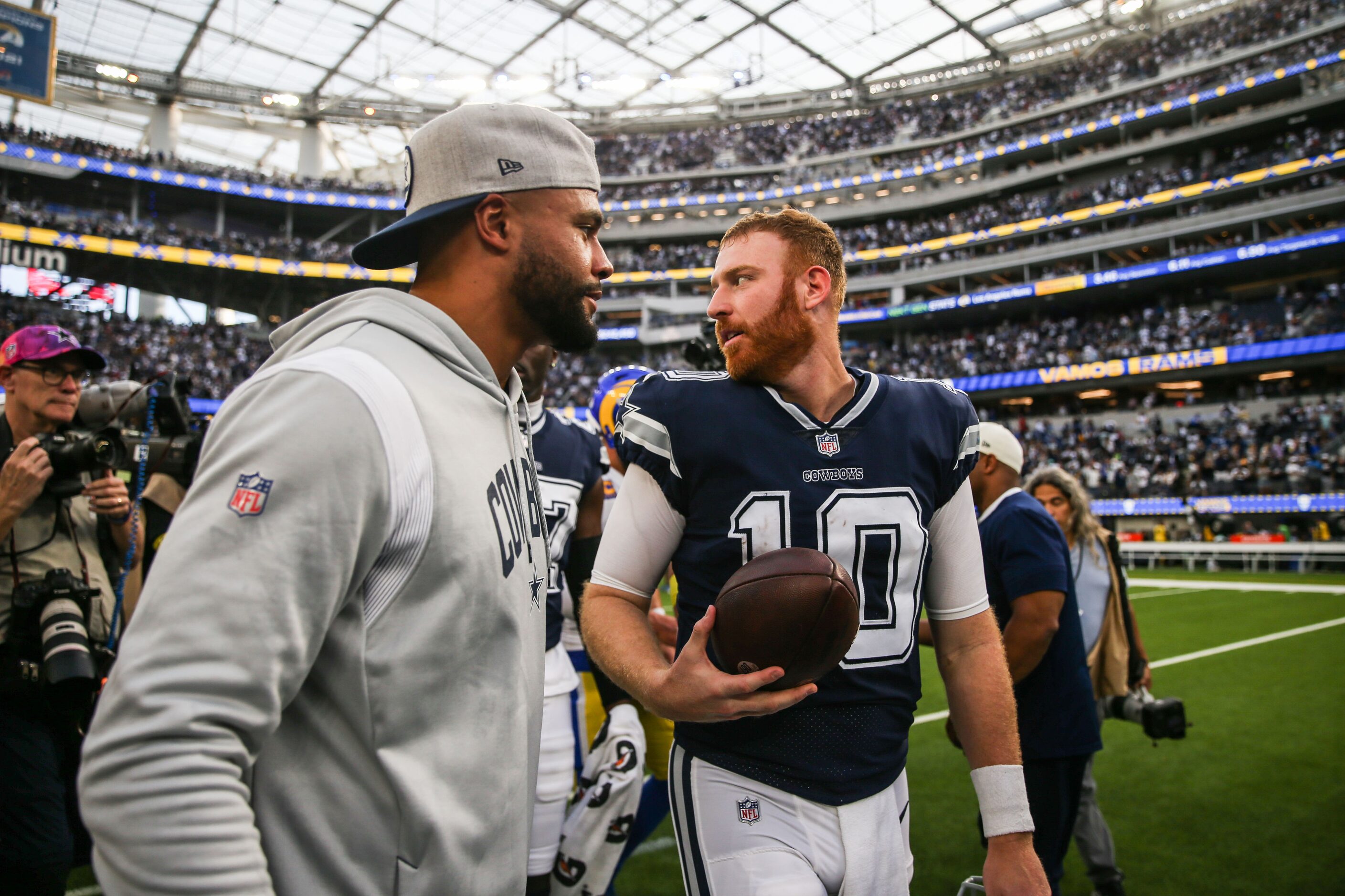 Dallas Cowboys quarterback Dak Prescott (4) congratulates quarterback Cooper Rush (10) after...