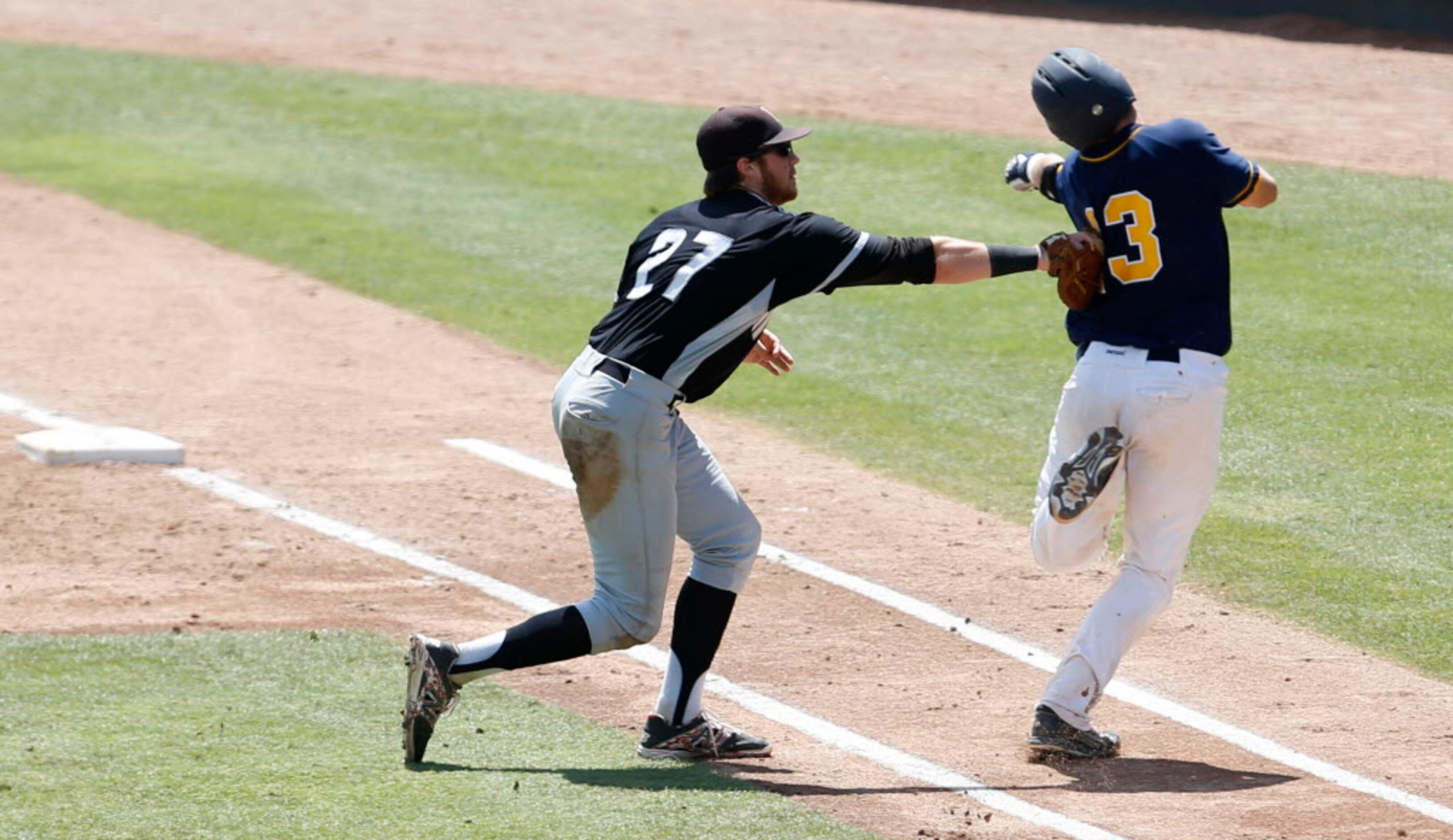 Martin's Aaron Fanning (27) tags out Cypress Ranch's Marshall Skinner (13) during the first...