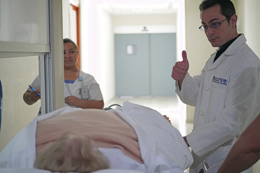 Dr. Thomas Parisi checks in on patient Donna Ferguson after her surgery.  "Everything went...