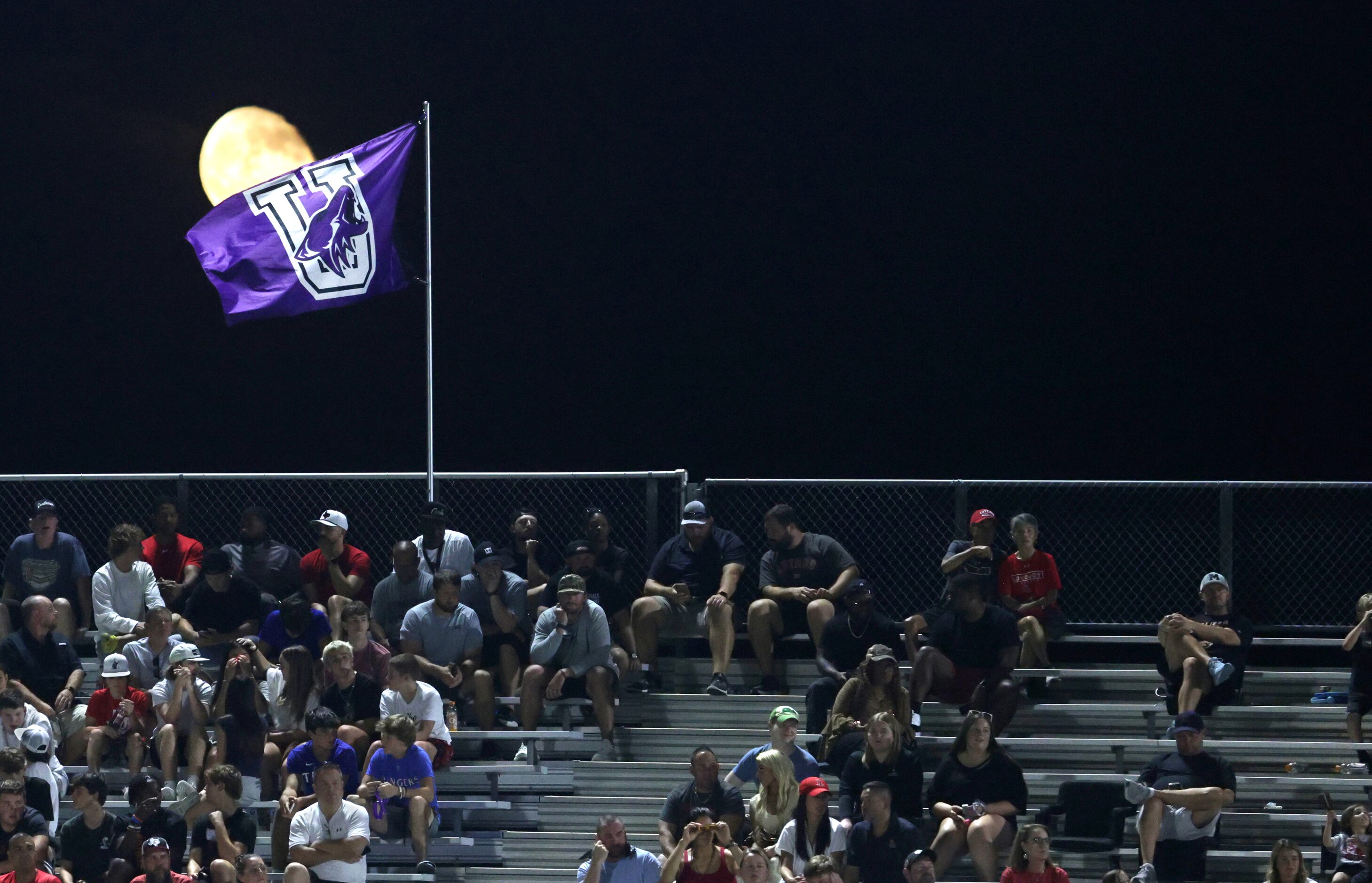 The moon rises over the football field during the Lovejoy High School at Anna High School...