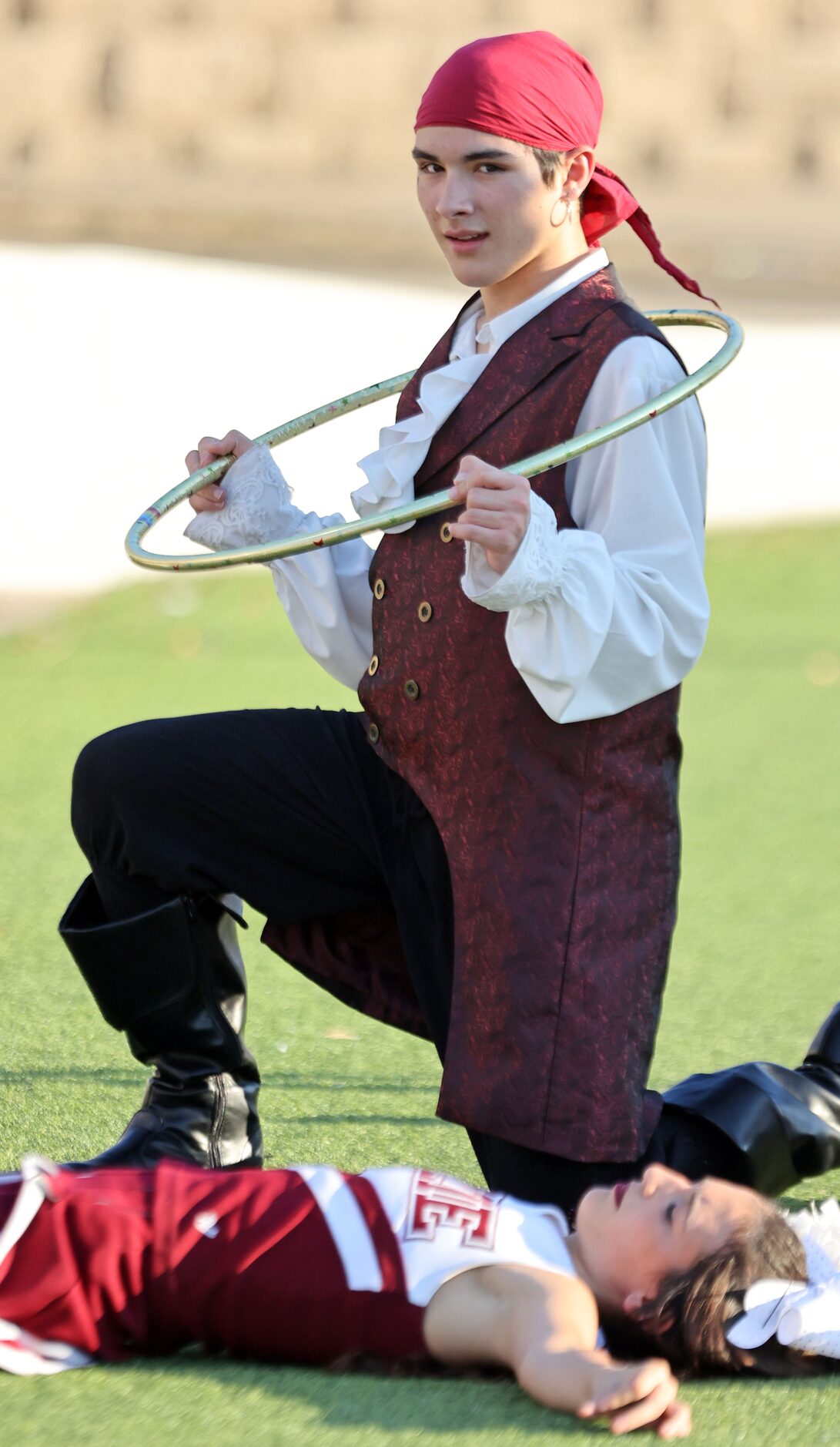 The Wylie High Pirate mascot sports a hula hoop on the sideline before the start of a high...