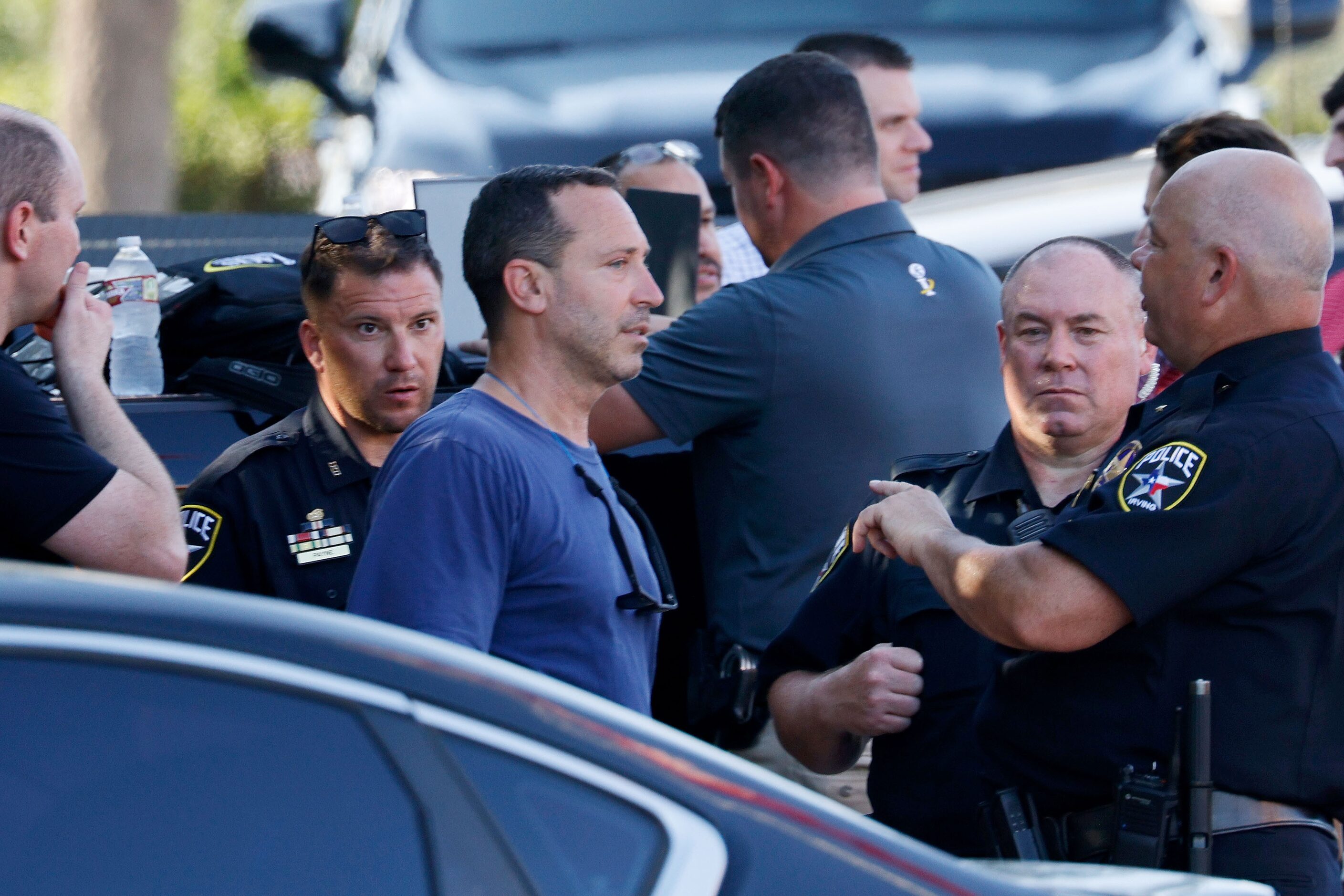 Police investigate in front of a Chick-fil-A at the scene of a shooting, Wednesday, June 26,...