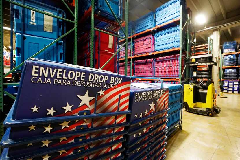 Election equipment and signage at the Maricopa County Elections Department warehouse in...