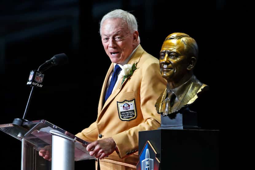 Dallas Cowboys owner Jerry Jones speaks next to a bust of him during inductions at the Pro...