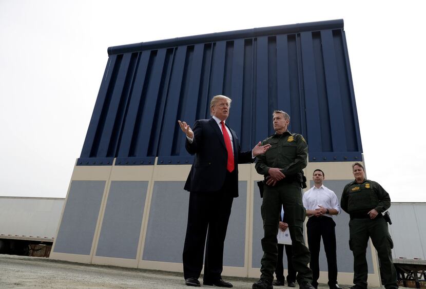 President Donald Trump reviews border wall prototypes on March 13 in San Diego.