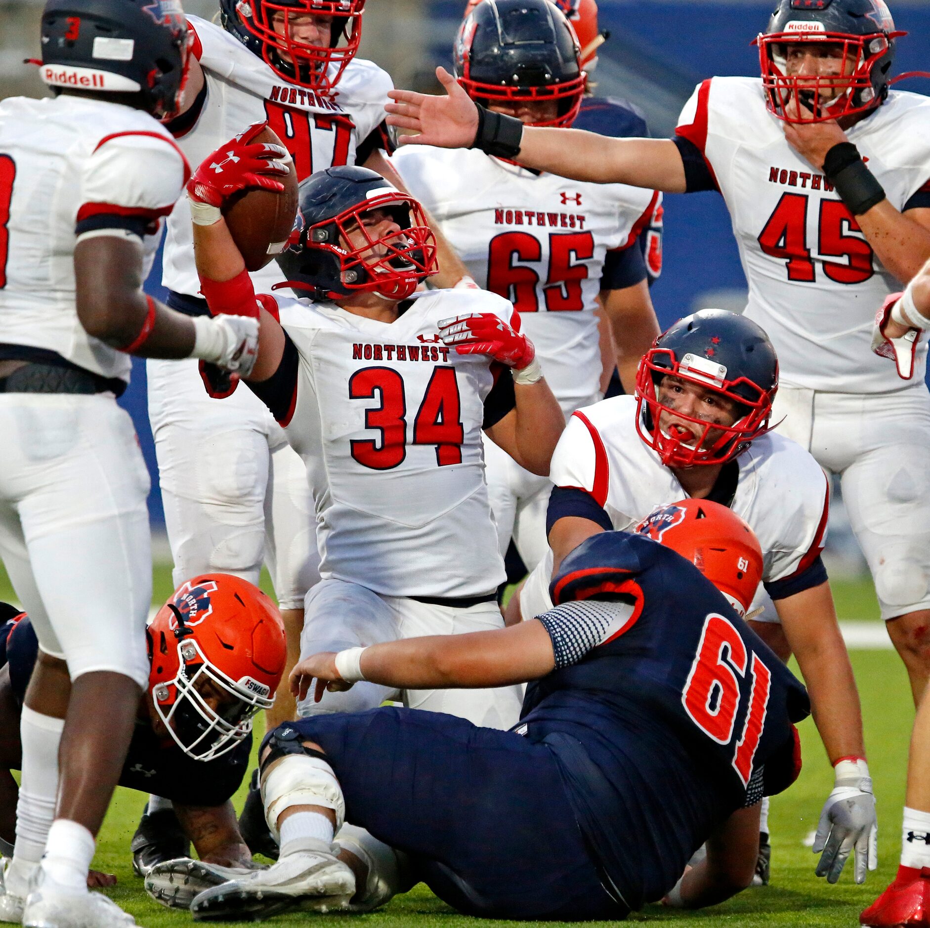 Northwest High School linebacker Gavin Ramos (34) jubilates over recovering a fumble near...