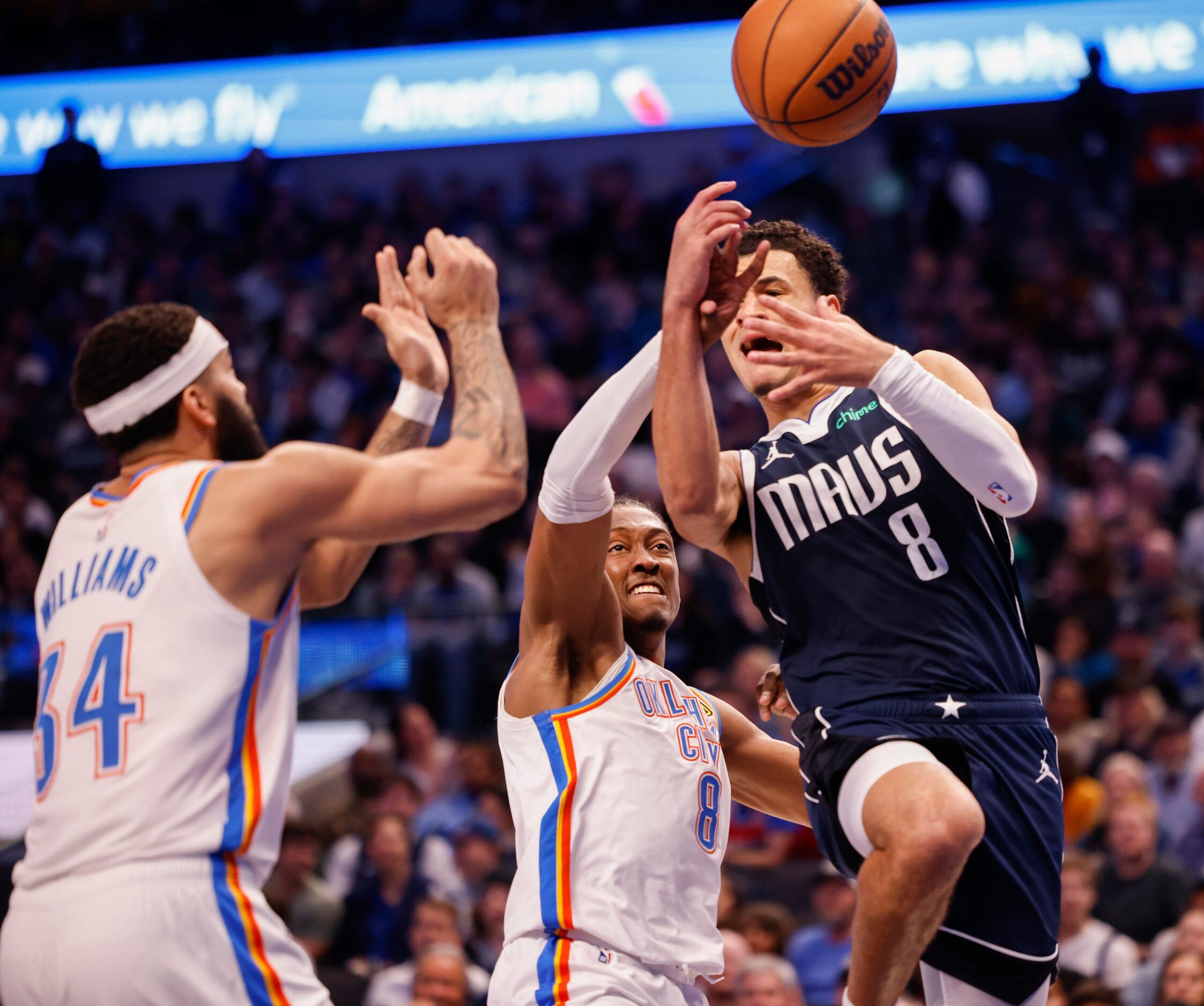 Dallas Mavericks guard Josh Green (8) is fouled by Oklahoma City Thunder forward Jalen...