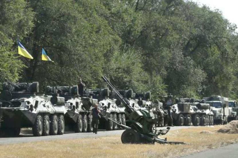 
Ukrainian forces parked their hardware and waited for the start of a march into Mariupol on...
