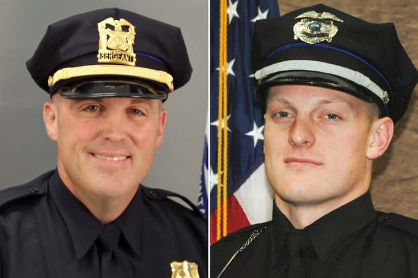 Sgt. Tony Beminio of the Des Moines Police Department (left) and Officer Justin Martin of...
