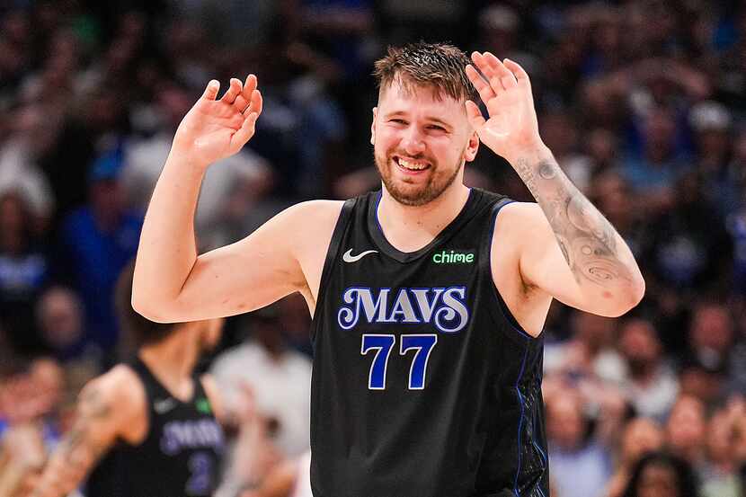 Dallas Mavericks guard Luka Doncic (77) reacts after a foul call during the second half in...