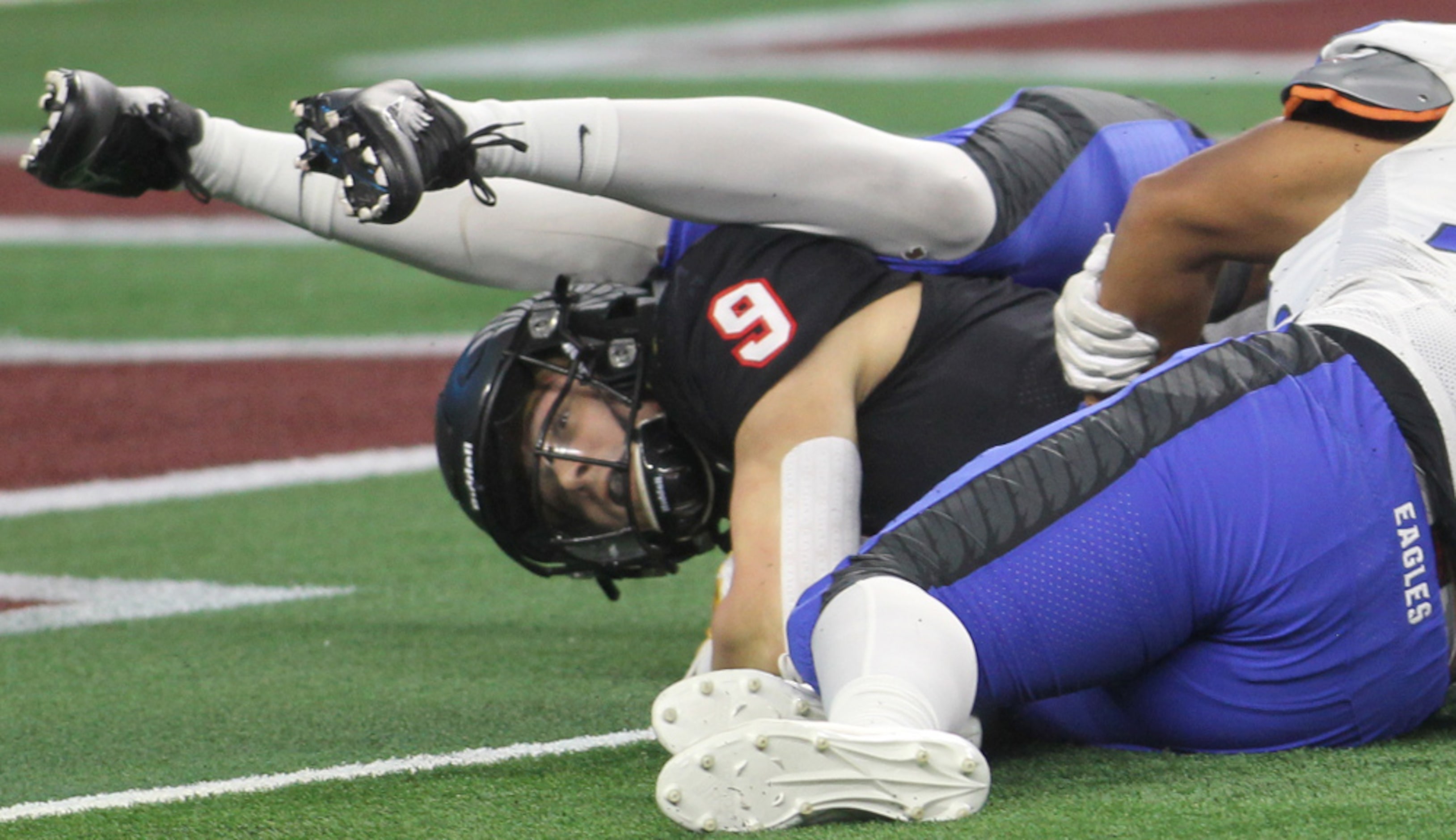 Argyle running back Tito Bice (9) is sandwiched by two Lindale defenders but was able to...