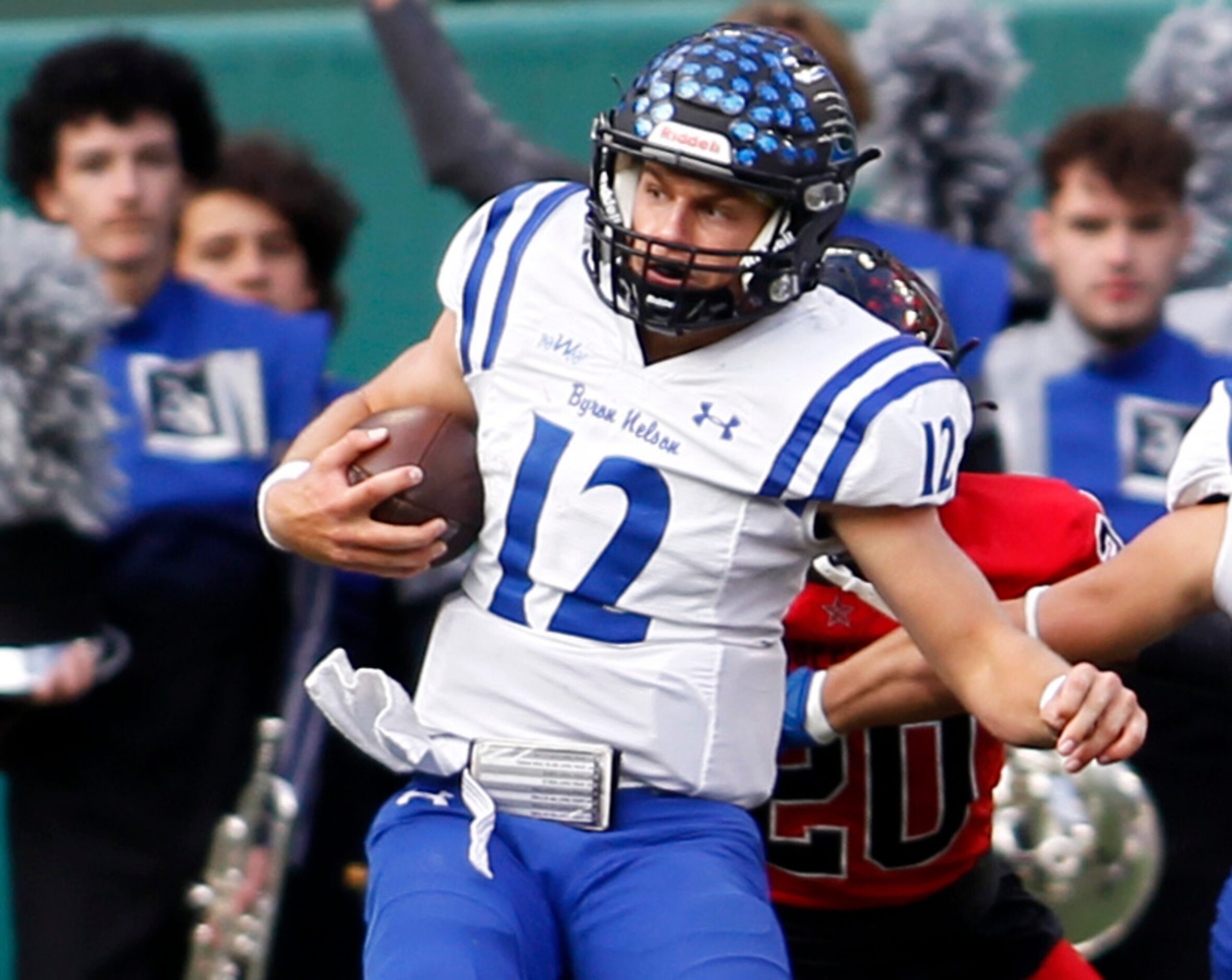 Byron Nelson quarterback Tom Von Grote (12) spins off a Coppell defender to score a...