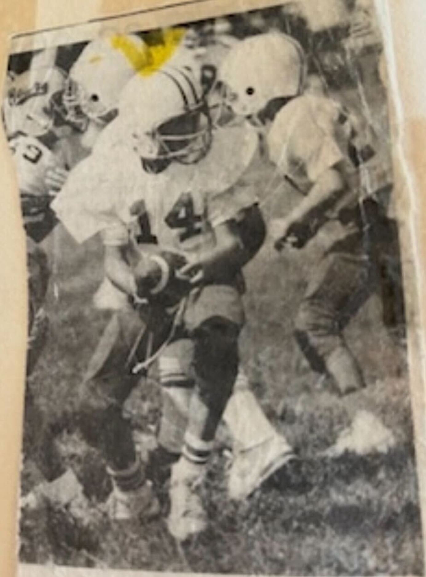 A photo of Mike Elko playing in a football game.