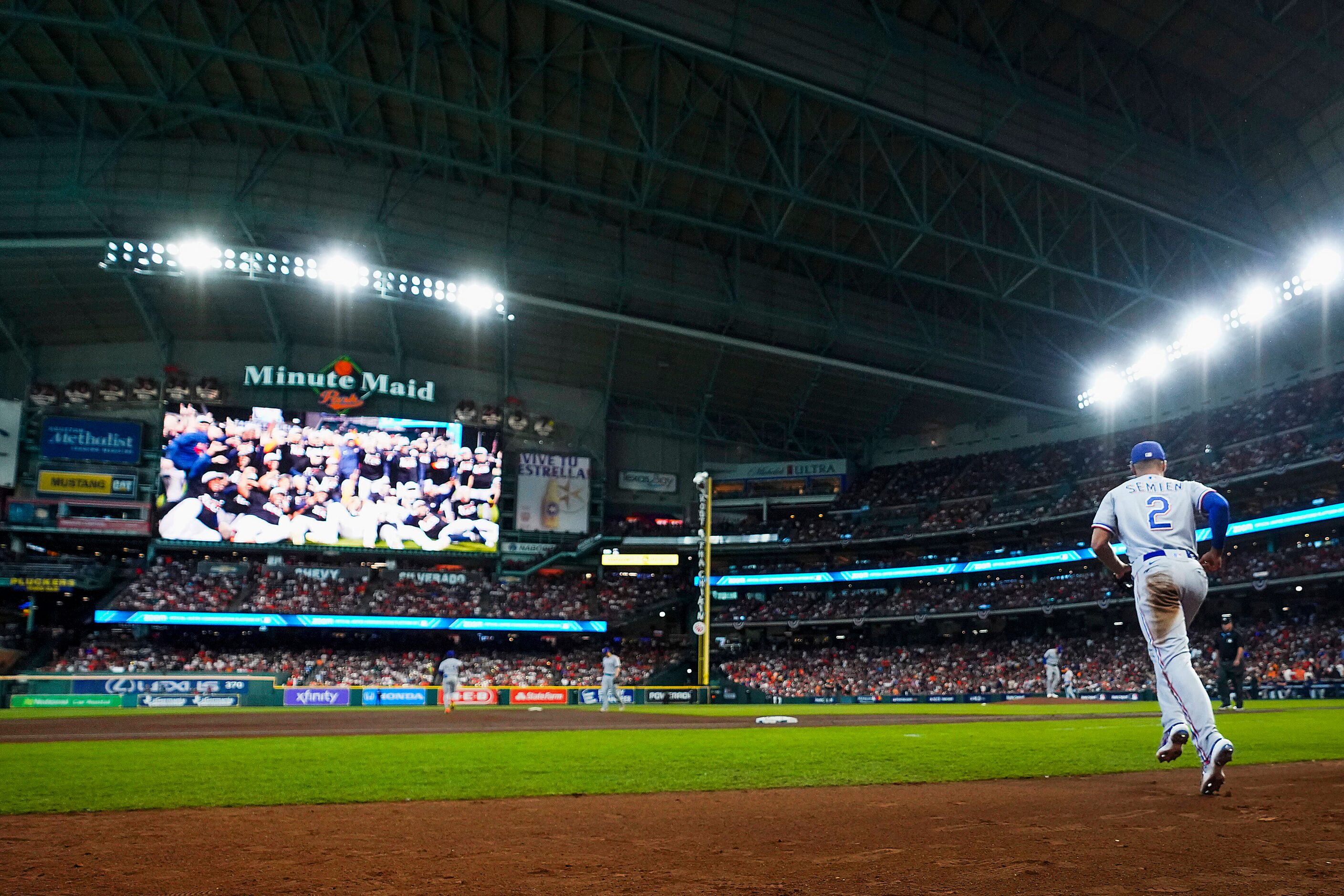 Texas Rangers second baseman Marcus Semien takes the field during the first inning in Game 2...