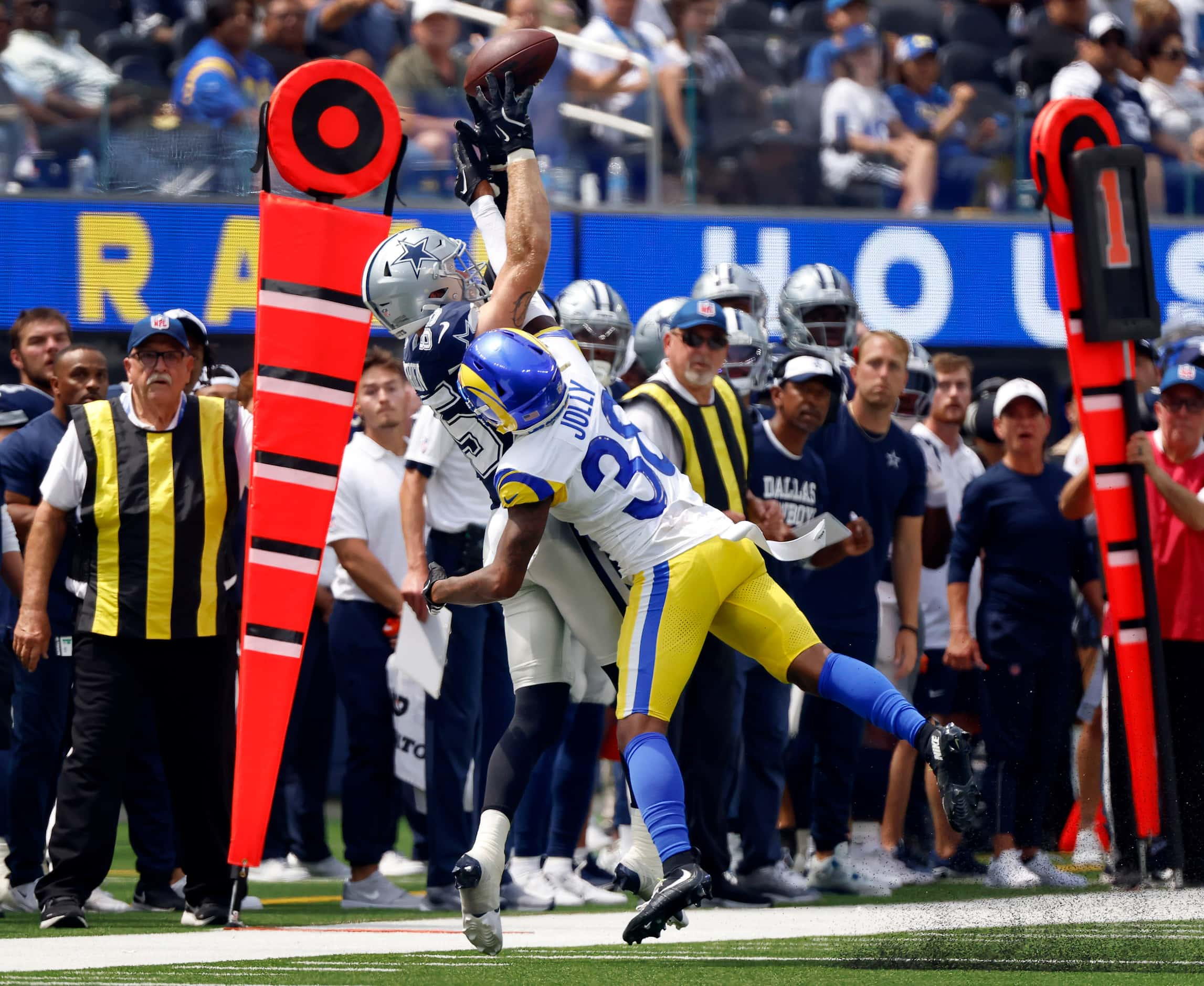 Los Angeles Rams cornerback Shaun Jolly (38) gets a hand on a pass intended for Dallas...