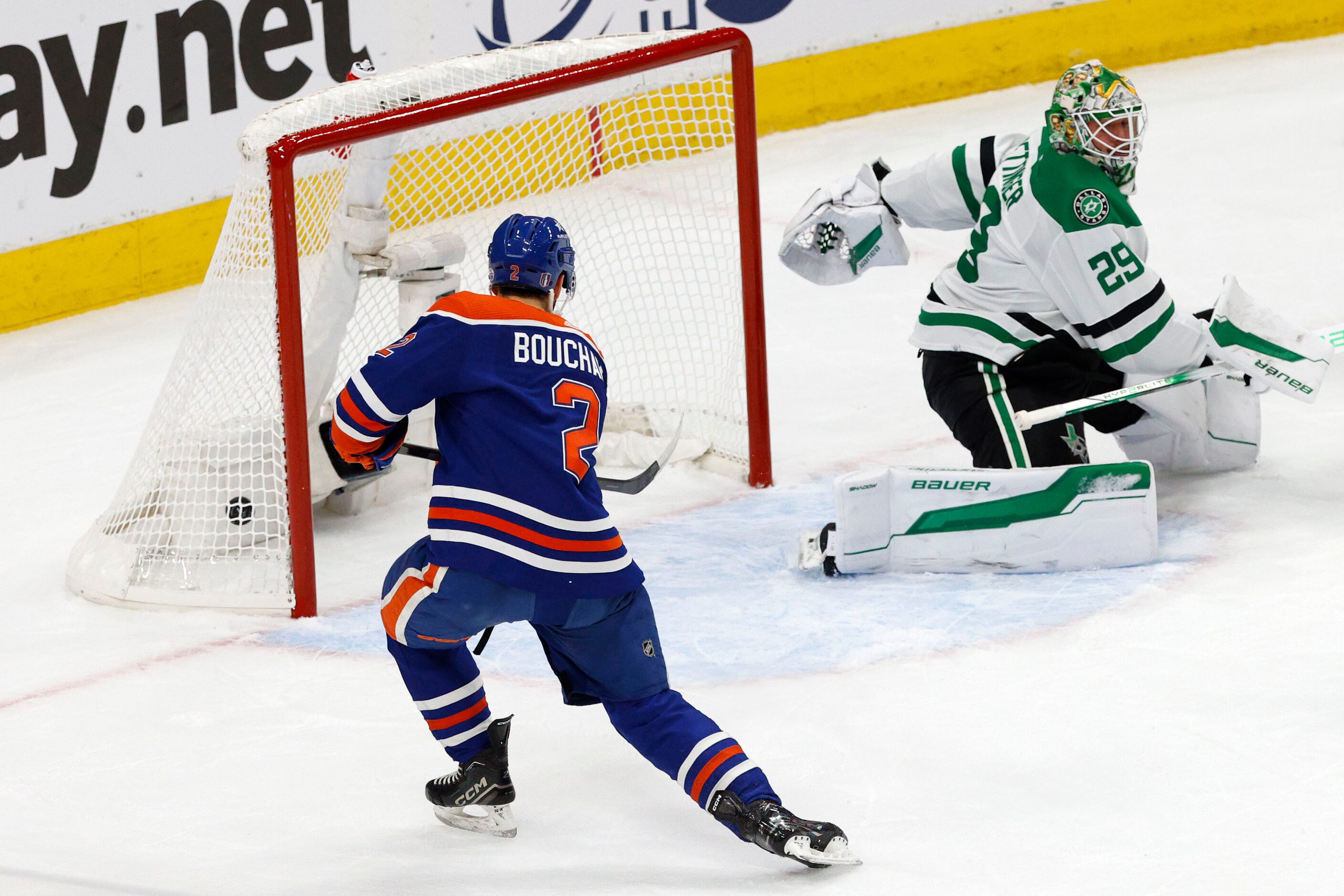 Edmonton Oilers defenseman Evan Bouchard (2) scores a goal against Dallas Stars goaltender...