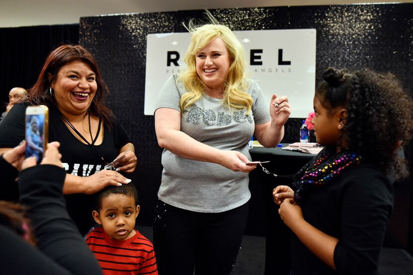 Rebel Wilson poses for photos with Crystal Joyner (left) of Arlington and her nephew and...