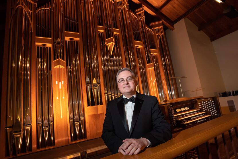 Organist Jeremy David Tarrant with the organ inside the Chapel on the campus of St. Mark's...