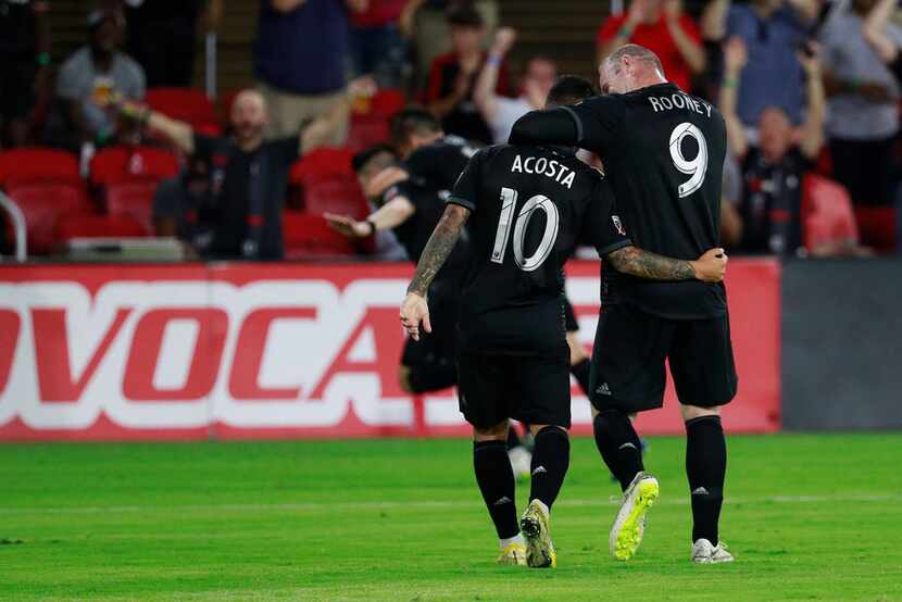 WASHINGTON, DC - JULY 14: Wayne Rooney #9 and Luciano Acosta #10 of D.C. United celebrate...